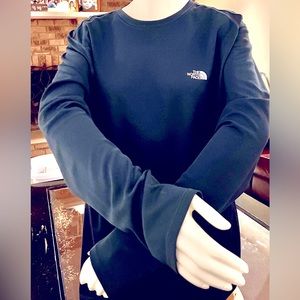 A men's long sleeve Vapor wick material by The North Face